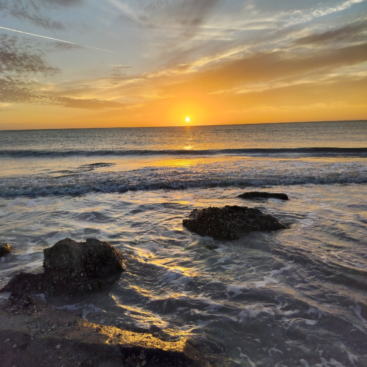 beach sunset with rocks