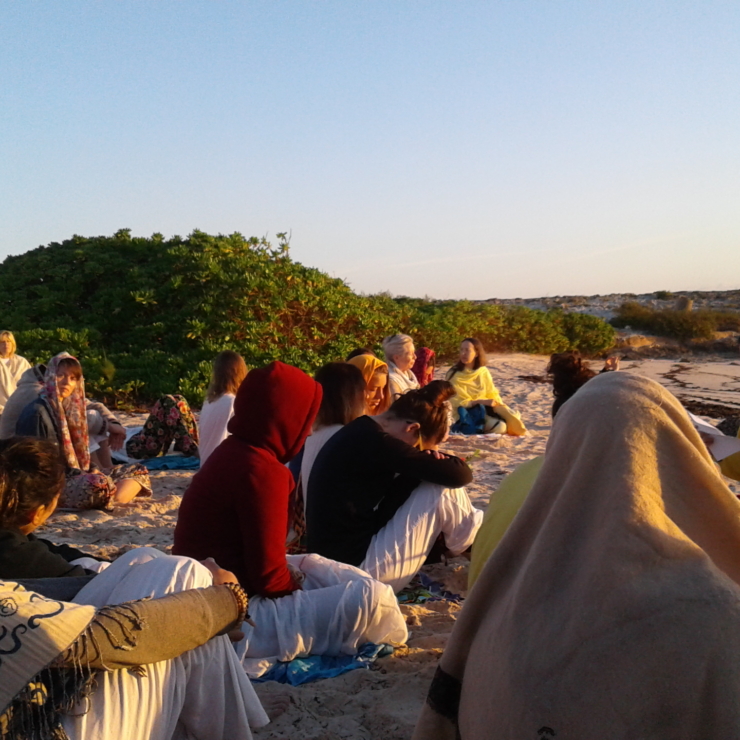 group meditation on the beach