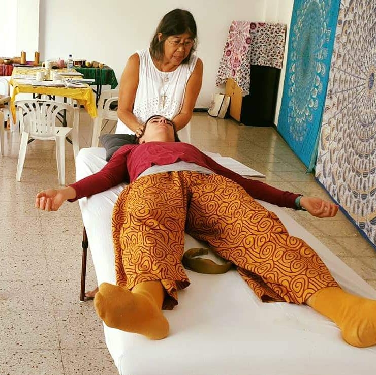 karuna healing a student on a healing table